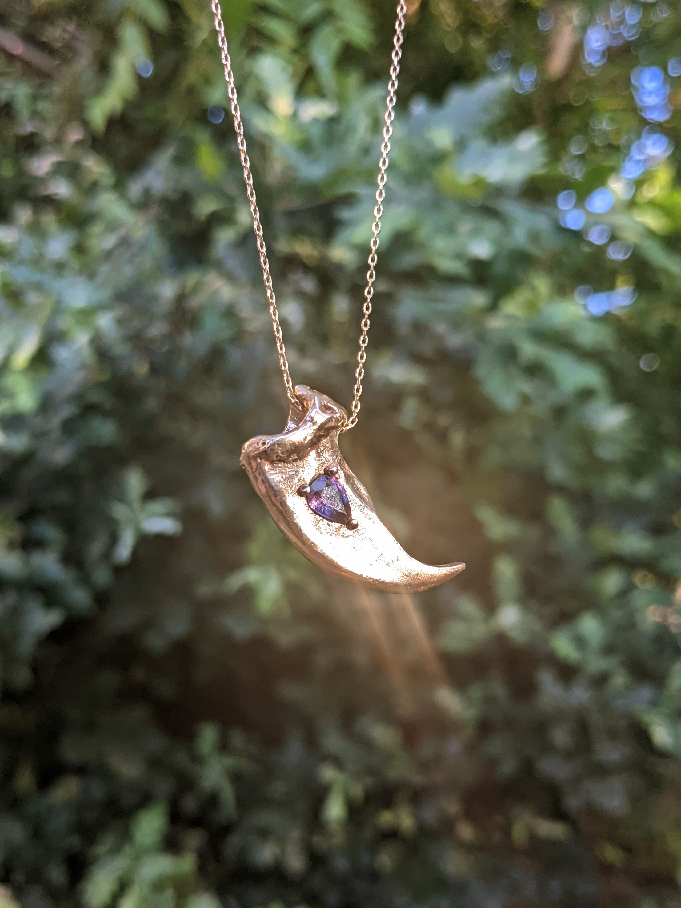 Kuma Yona necklace, Violet Sapphire and Bronze.